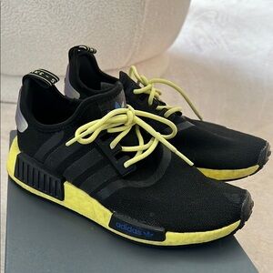 Adidas NMD_R black pulse yellow sneakers.